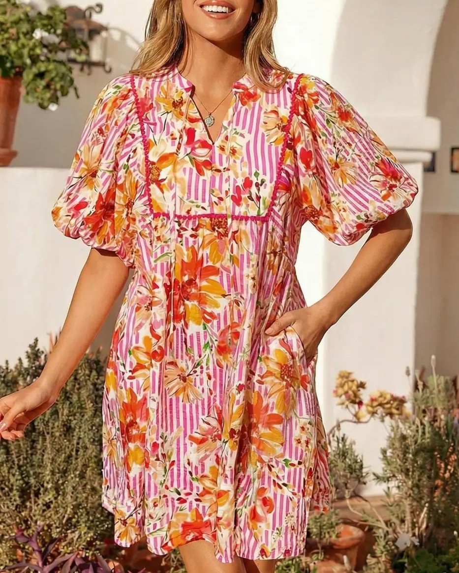 Who said you can't have it all? 🌸✨

This Floral Striped Tie Neck Puff Sleeve Mini Dress combines florals, stripes, and a touch of romance. The adjustable tie neck and dramatic puff sleeves make it perfect for any occasion. 

Express yourself effortlessly this season! 

#FashionForward #MaximalistStyle #MiniDressMagic #SummerFashion #FloralStripes