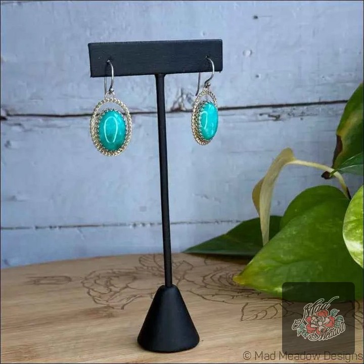 These earrings are not just accessories; they're a statement! ✨ 

Crafted with stunning Amazonite and a warm gold-filled halo, they bring a unique flair to any outfit. Perfect for adding a pop of color and a touch of elegance, these beauties will have heads turning wherever you go. 

Grab yours now! 
 

#AmazoniteEarrings #BohoStyle #JewelryLovers #MadMeadowDesigns #CharmingAccessories
