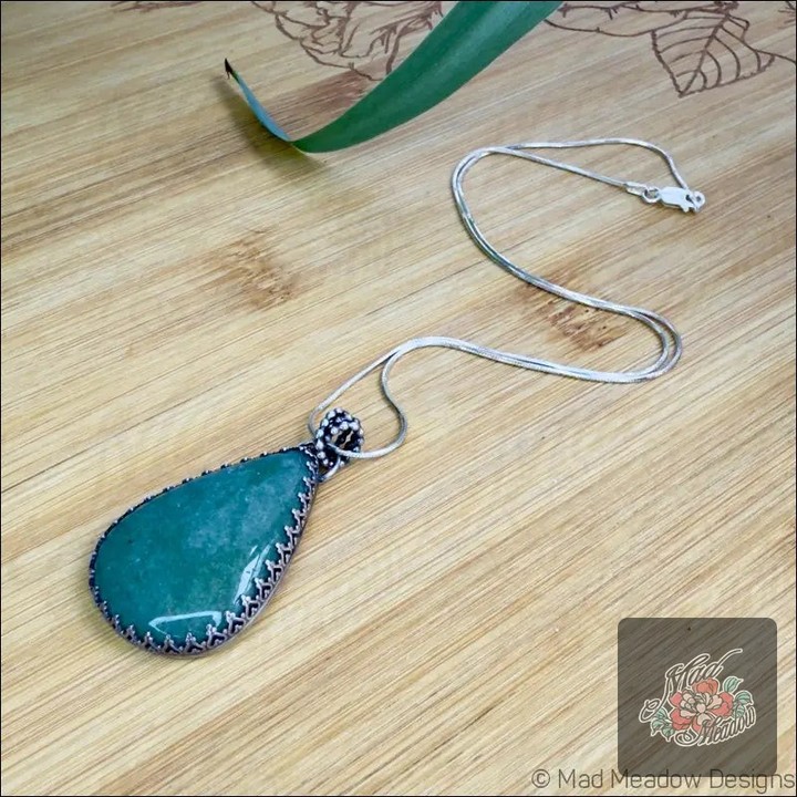 Ever wondered how a piece of jewelry could transform your vibes? 

Meet the Green Aventurine Sterling Silver Drop Pendant Necklace! 

Crafted with care, this stunning pendant not only looks beautiful but also brings a sense of abundance and prosperity. 

Its vibrant green hue connects you to nature, inspiring a deeper appreciation for life's gifts. 

And the best part? It’s now available for only $155.00! 

Wear it and feel the energy shift. ✨ 

👉 Check it out here: 

#MadMeadowDesigns #GreenAventurine #SterlingSilver #BohoJewelry #UniqueStyle