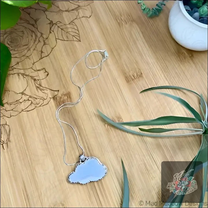 Ever wonder how a simple piece of jewelry can transform your mood? 

Meet the Sterling Silver Opalite Cloud Pendant Necklace. 

This isn’t just a necklace; it’s a radiant charm that reflects your inner spirit. 

The whimsical Opalite glimmers with colorful clarity, guiding you toward tranquility and self-discovery. 

Wearing it feels like carrying a piece of the sky with you—perfect for those who embrace their emotions and seek resilience. 

Now at $195.00, it’s your turn to shine! 

Shop now: 

#Opalite #JewelryMagic #BohoChic #MadMeadowDesigns #SelfDiscovery