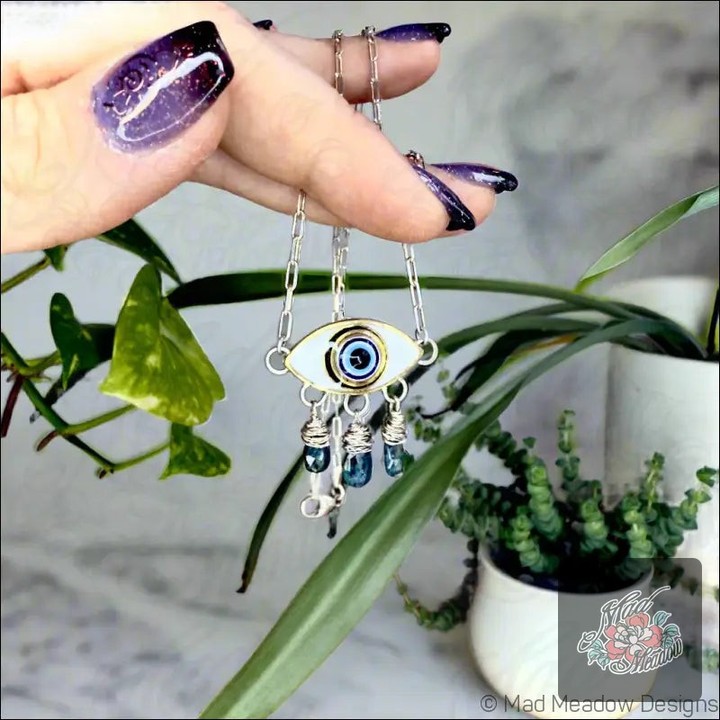Unlock the magic of protection with our Evil Eye Pendant Necklace! ✨✨

This stunning piece features:
🧿 Sterling silver evil eye design 
💙 Three wire-wrapped blue kyanite droplets 
📏 18" elegant cable chain

Let the enchanting blue kyanite awaken your truth and guard against negativity. 

Grab yours now for just $170.00! Offer ends soon—don’t miss out! 

Shop here: https://ssdlr.shop/l/c883bacd 

#EvilEye #Kyanite #JewelryWithMeaning #MadMeadowDesigns #ProtectiveJewelry