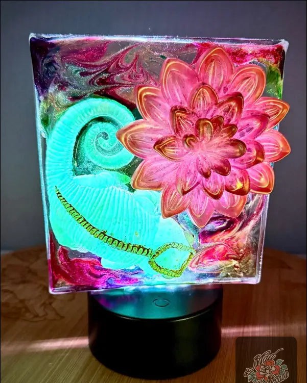 Feeling like your space is missing a bit of magic? 🦎✨ 

Transform your room into an enchanting oasis with our Glowing Chameleon and Vibrant Fuscia and Gold Flower Night Light! 

Watch as the chameleon's luminous scales dance through colors, creating a mesmerizing atmosphere tailored to your mood. Whether you crave calming hues or bold tones, this light does it all.

Power it up with USB or batteries, and enjoy effortless control with the remote. 

Brighten your nights for only $55.00! 

#HomeDecor #NightLight #BohemianStyle #GlowInTheDark #MadMeadowDesigns
