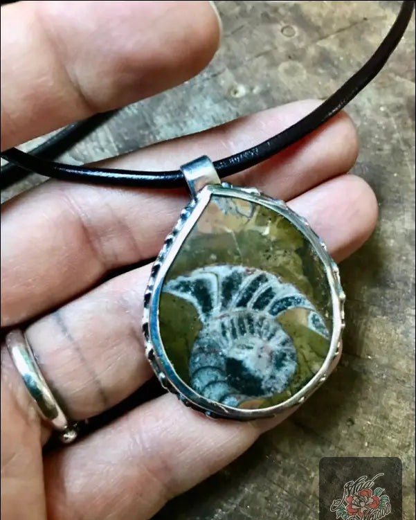 Did you know a piece of jewelry can carry the weight of ancient history? 

Our Alaskan Ammonite Sterling Silver Pendant Necklace isn’t just beautiful; it's a conversation starter. 

Crafted from an antique sterling napkin ring, this necklace holds the spirit of a species that went extinct 66 million years ago. 

Embrace change, release old patterns, and tap into your intuition with this stunning accessory. 

Now at $195.00, it’s a timeless treasure for your collection! 

Discover your new favorite piece here: 

#JewelryWithHistory #HandcraftedBeauty #AmmoniteMagic #BohoChic #MadMeadowDesigns