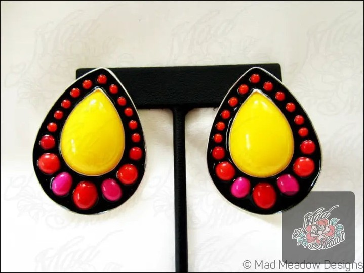 Who says jewelry can’t be a conversation starter? 

Meet our Frida Teardrop Earrings—designed to spark joy and color your world! 

Crafted from lightweight sterling silver and vibrant N.O.S. lucite, they’re a true nod to Frida Kahlo’s artistic spirit. 

Whether you're dressing up or keeping it casual, these earrings add a bold pop that makes every outfit shine. 

Ready to make your statement? Now at $175.00! 

Shop now: 

#MadMeadowDesigns #ColorPop #FritaEarrings #ArtisanJewelry #BoldStyle