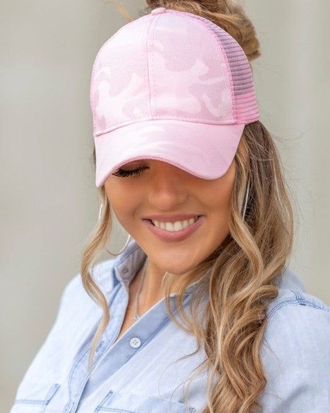 Fun Camo Color Messy Bun Ponytail Cap
 26.0 USD

 Experience the convenience and style with our Fun Camo Color Messy Bun Ponytail Cap. Keep your hair up and your head protected from the sun while adding a touch of fun with our unique camo color design. Perfect for on-the-go and outdoor activities.
 
 Keep your on-the-go casual look pulled together with our Camo Messy Bun Hats! All the functions of a regular ball cap, plus a strategic opening high in the back that allows you to throw that hair up in a messy bun, half-up or high ponytail.*Monochromatic camo design*High ponytail/ messy bun opening*Adjustable Velcro twill closure *Structured, fitted crown*Fits teen-adult*Mesh back*Snapback
 
 

Style: Messy bun cap

Embellishment: mono camo design

Closure: velcro, adjustable

 https://fashionsenvy.com/products/fun-camo-color-messy-bun-ponytail-cap