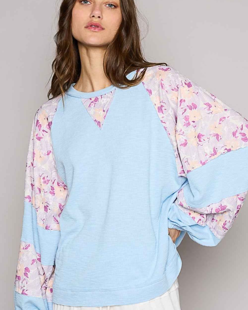 POL Round Neck Balloon Floral Long Sleeve Top
 59.0 USD

 The Round Neck Balloon Floral Long Sleeve Top is a charming and feminine addition to your wardrobe. With a round neckline and balloon sleeves, this top exudes a romantic and elegant vibe. The floral print adds a touch of whimsy and sophistication to the design. Perfect for layering or wearing on its own, this top is versatile for various occasions. Made with long sleeves, it offers both style and warmth for cooler weather. Pair it with jeans or a skirt for a stylish and polished ensemble that will surely make a statement. Elevate your look with this floral long-sleeve top that combines classic charm with trendy details effortlessly.
 
Features: Basic style
Sheer: Opaque
Stretch: No stretch
Material composition: 71% polyester, 23% rayon, 6% spandex
Care instructions: Machine wash cold. Tumble dry low.
Imported
Product measurements:
 S:Bust 34-36 in, Waist 26-28 in
 M:Bust 37-38 in, Waist 29-31 in
 L:Bust 39-40 in, Waist 32-33 in

 https://fashionsenvy.com/products/pol-round-neck-balloon-floral-long-sleeve-top