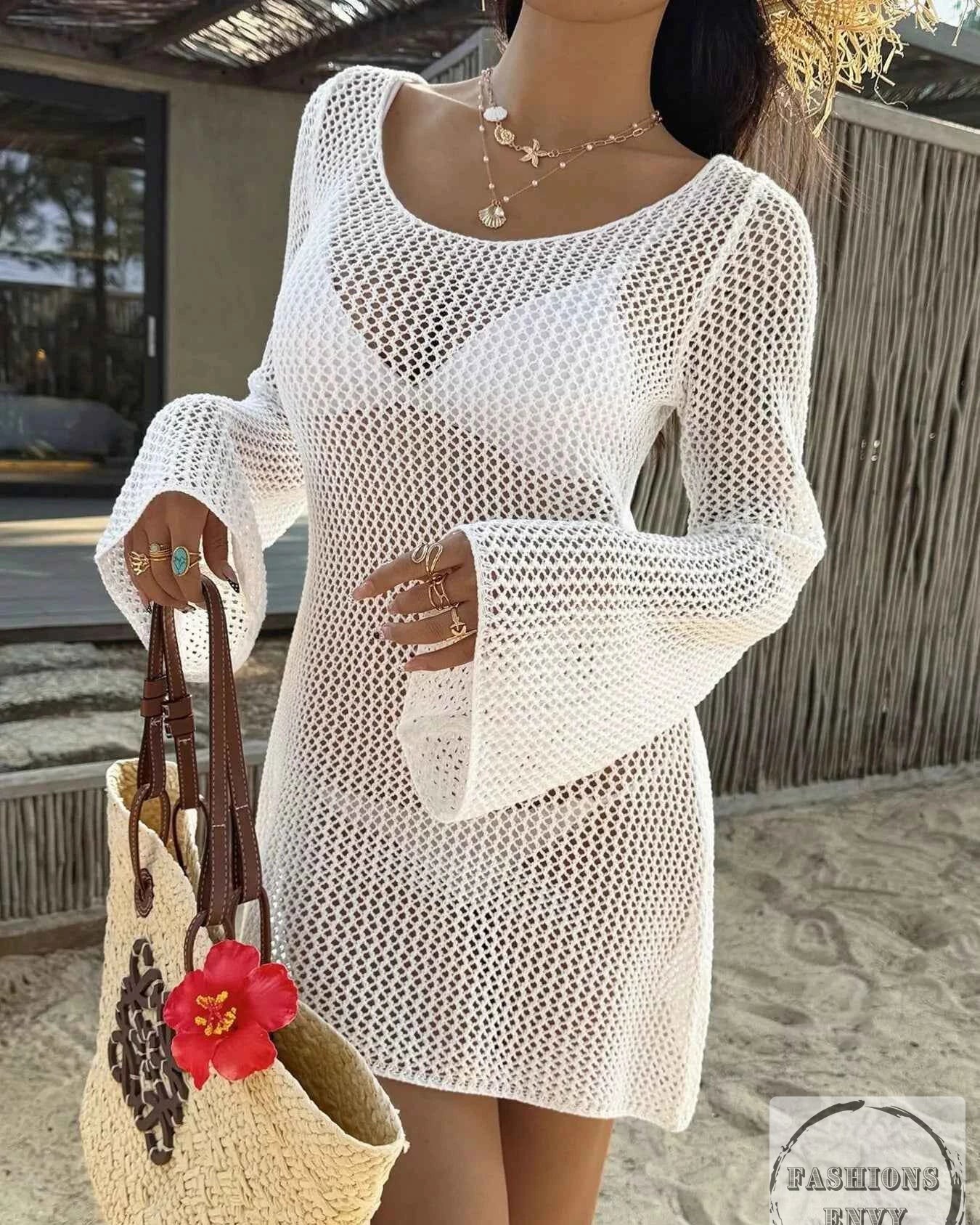 Ready to turn heads at the beach? 

Our White Cover Up Dress is your new summer essential! With its stunning openwork knit and long sleeves, you'll stay cool and chic whether you're lounging by the pool or dining seaside. 

Perfect for warm weather, it features a flattering tie waist and stylish side slits. 

Shop now: 
 

#BeachStyle #CoverUpDress #SummerFashion #OpenworkKnit #NewArrivals