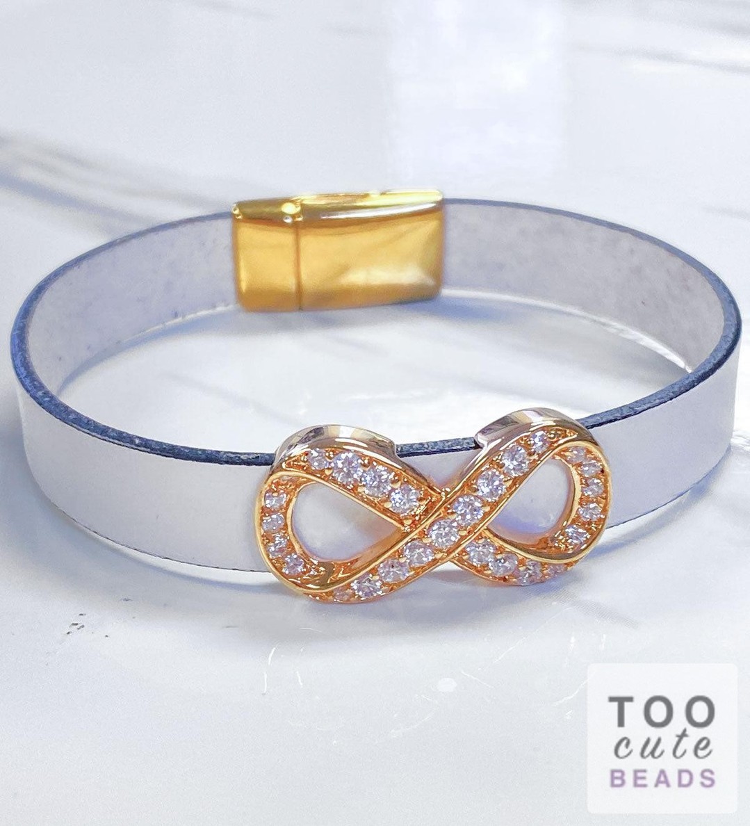 Wrap your wrist in endless elegance! ✨ Create your own stunning Golden Infinity Bracelet with our...